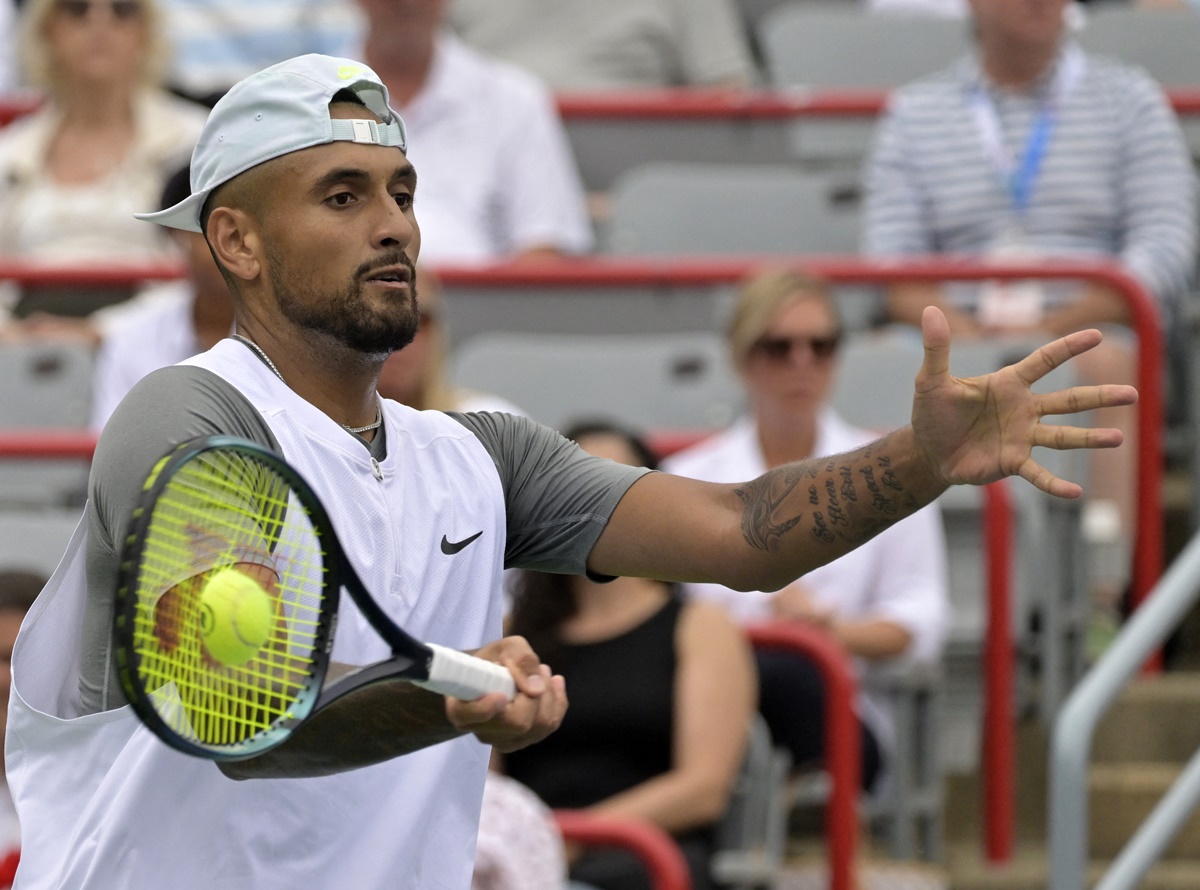 Nick Kyrgios makes a forehand return against Hubert Hurkacz.