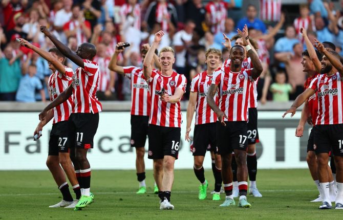Brentford's jubilant players celebrate after the resounding victory over Manchester United in the Premier League match at Brentford Community Stadium, London, on Saturday.