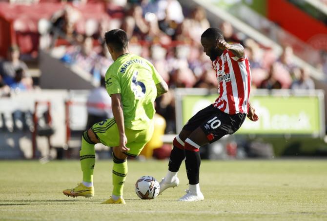 Josh Dasilva scores Brentford's first goal.