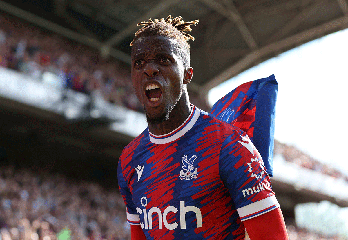 Crystal Palace's Wilfried Zaha celebrates their first goal scored by Jean-Philippe Mateta