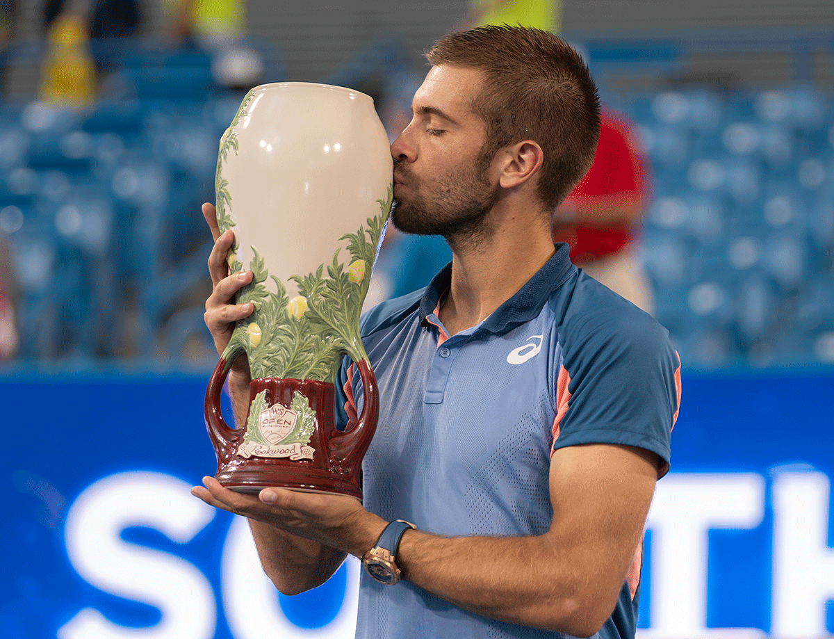 Croatia's Borna Coric  kisses the trophy after defeating Greece's Stefanos Tsitsipas in the final at the Western & Southern Open at the Lindner Family Tennis Center in Cincinnati, Ohio, on Sunday