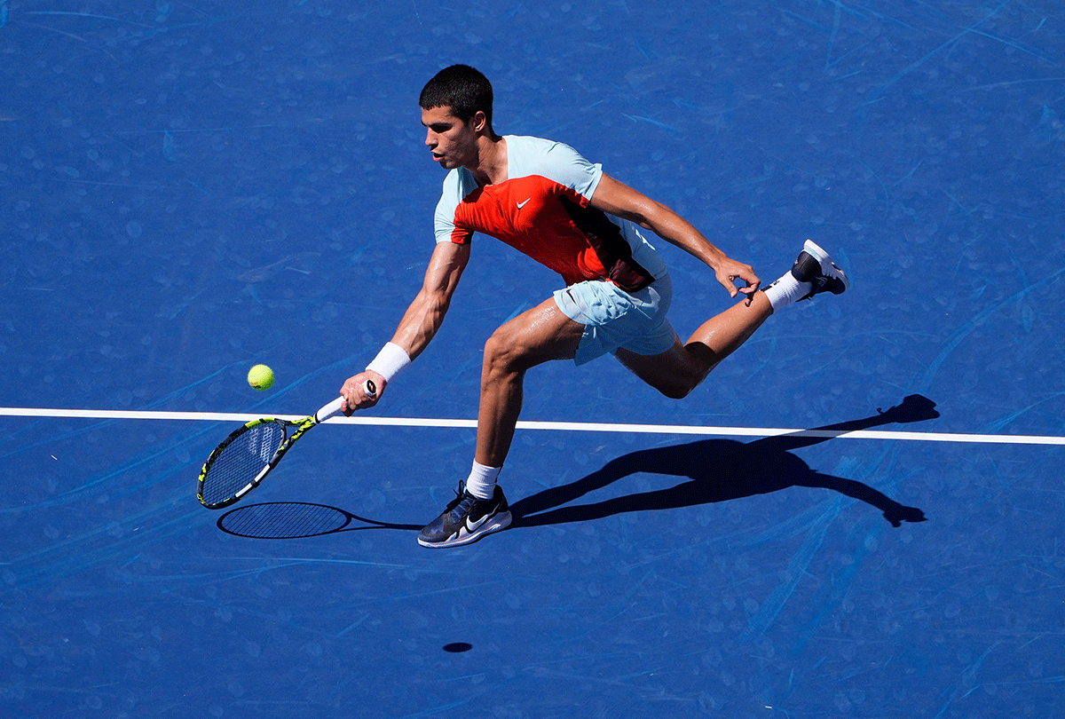 Spain's Carlos Alcaraz plays a return against Argentina's Sebastian Baez