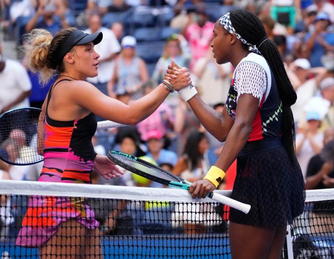 Coco Gauff and Leolia Jeanjean meet at the net after their first round match.