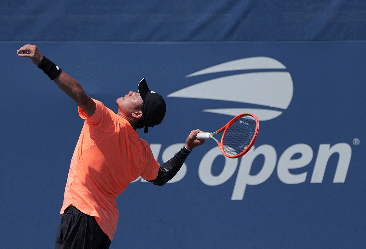 China's Yibing Wu serves during his match against Georgia's Nikoloz Basilashvili