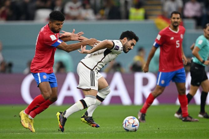  Germany's Ilkay Guendogan is challenged by Costa Rica's Johan Venegas 