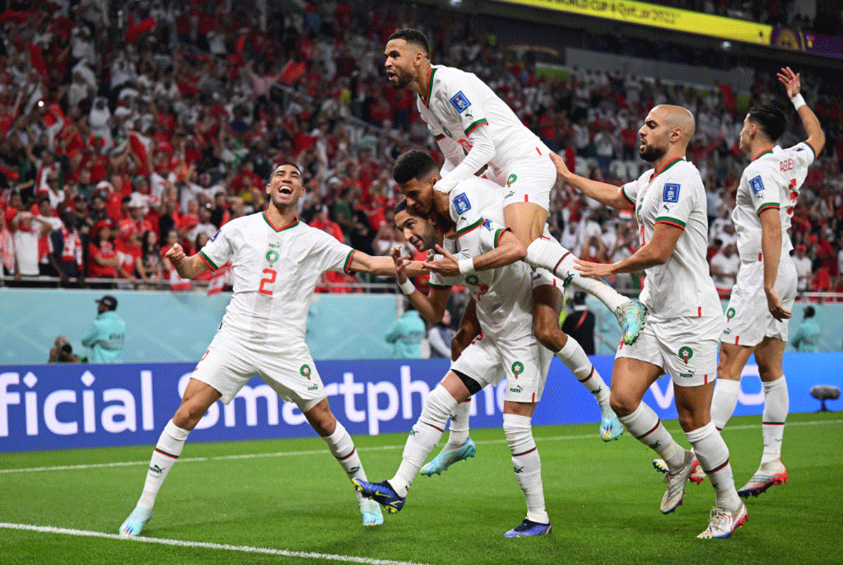 Morocco's Hakim Ziyech celebrates with teammates after scoring the opener