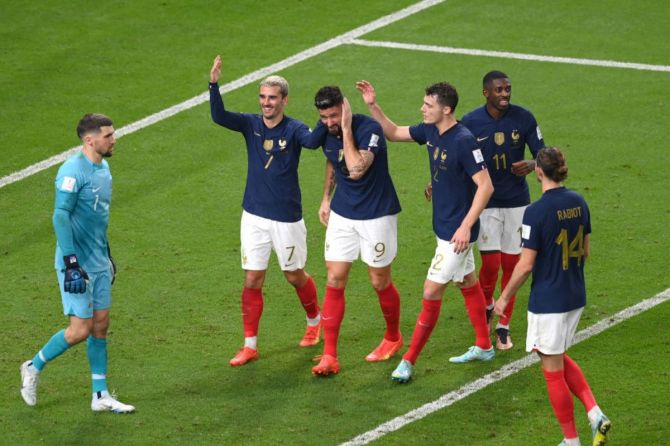 France striker Olivier Giroud (2nd l) celebrates with teammates after scoring the third France goal