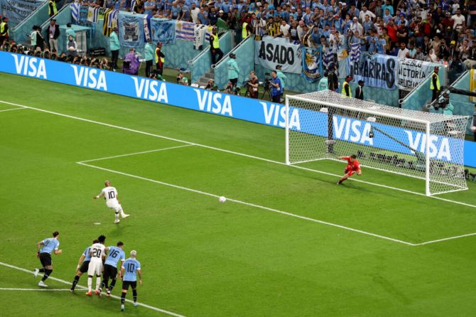 Sergio Rochet of Uruguay makes a save on a penalty by Andre Ayew of Ghana during the FIFA World Cup Qatar 2022 Group H match between Ghana and Uruguay