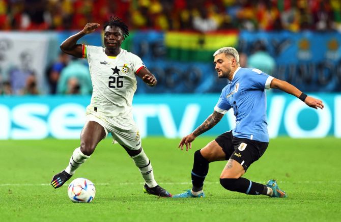 Ghana's Seidu Alidu in action with Uruguay's Giorgian de Arrascaeta
