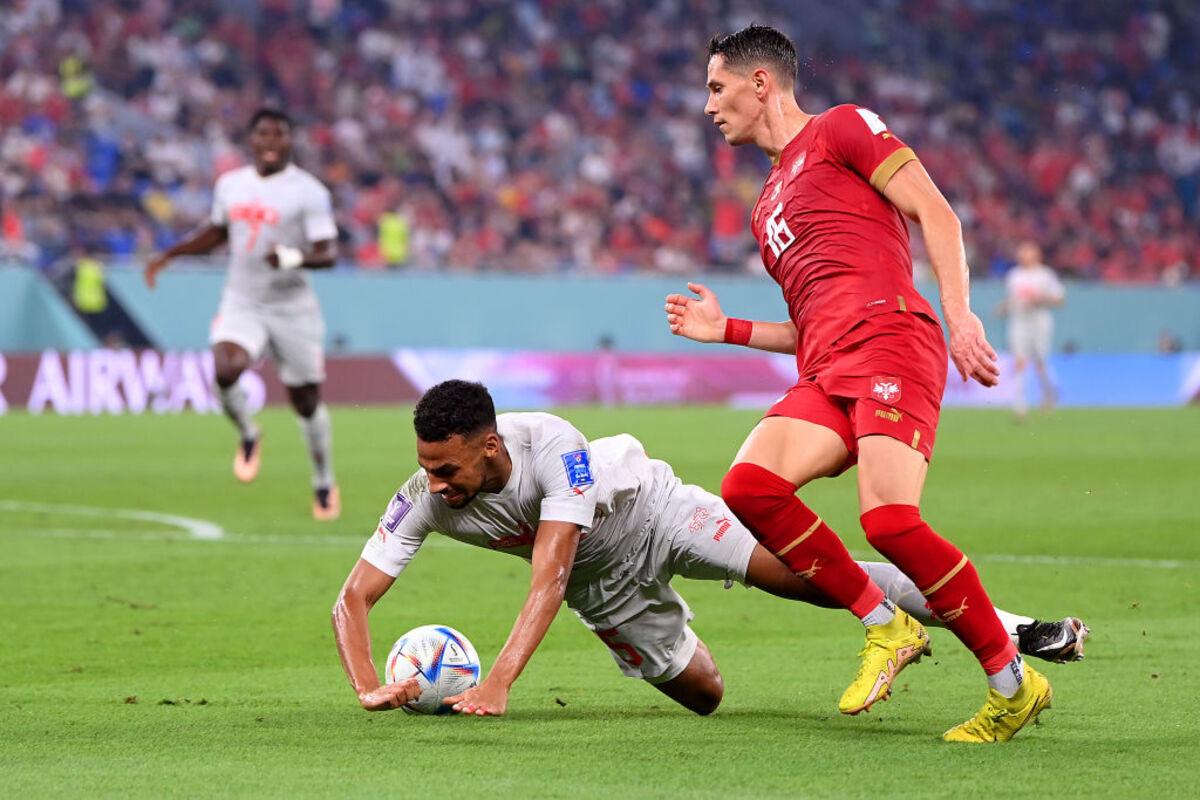 Djibril Sow of Switzerland is challenged by Sasa Lukic of Serbia