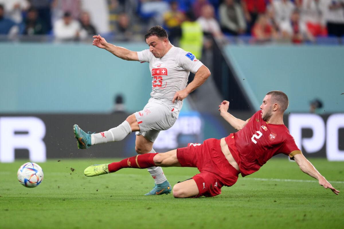 Xherdan Shaqiri of Switzerland is tackled by Strahinja Pavlovic of Serbia