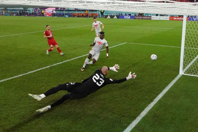Breel Embolo of Switzerland scores the team's second goal past Vanja Milinkovic-Savic of Serbia