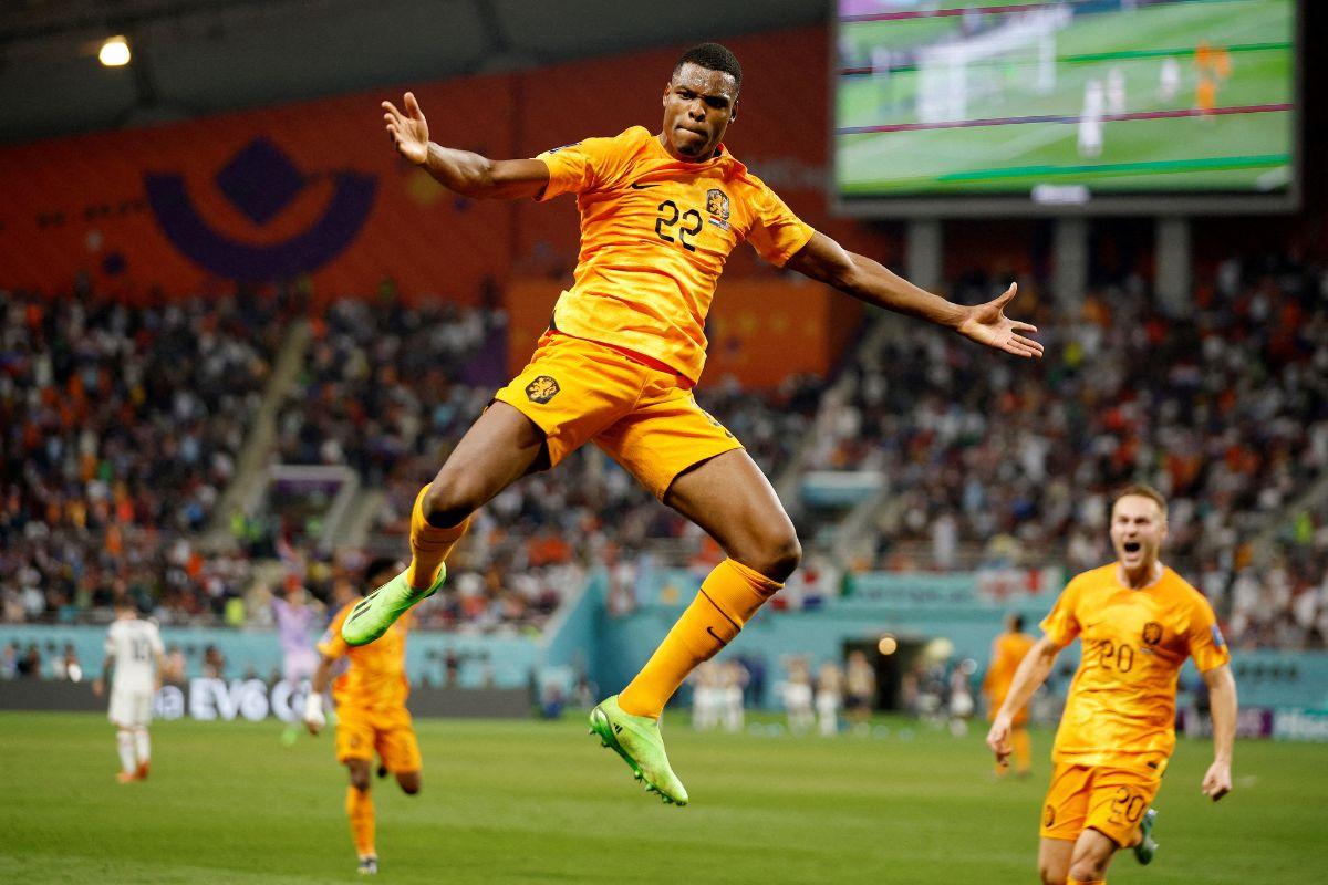 Netherlands' Denzel Dumfries celebrates scoring their third goal