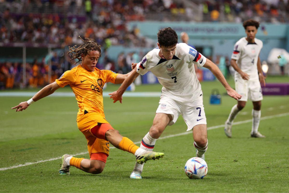 USA's Giovanni Reyna is tackled by Xavi Simons of the Netherlands