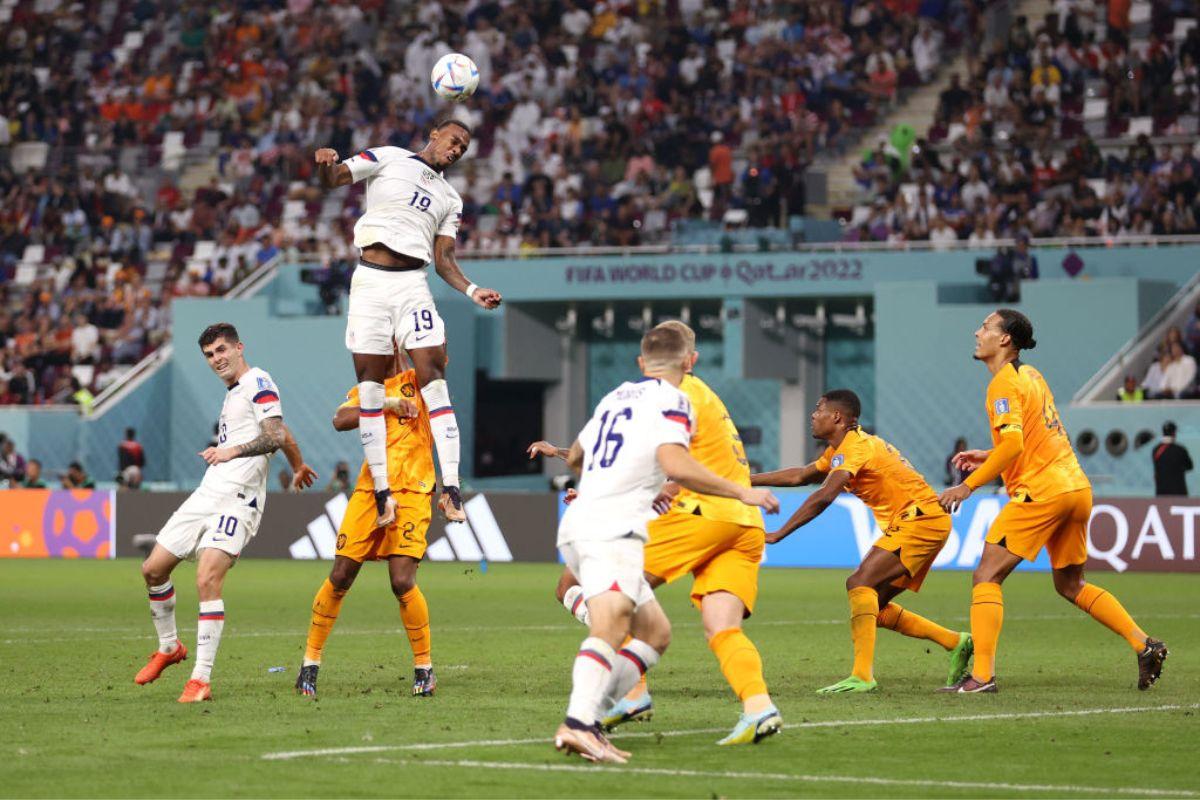 USA's Haji Wright heads the ball