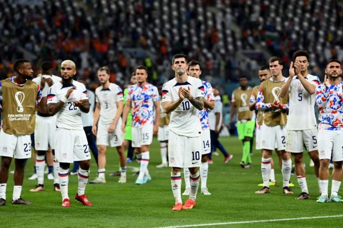 United States players applaud fans after the match as United States are eliminated from the World Cup