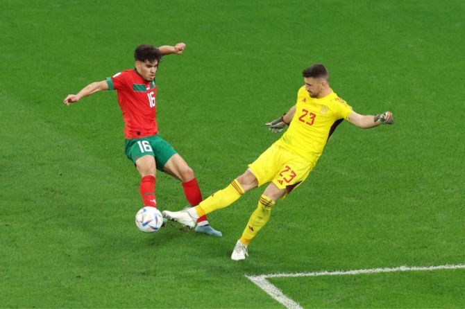 Unai Simon of Spain clears the ball against Abde Ez of Morocco