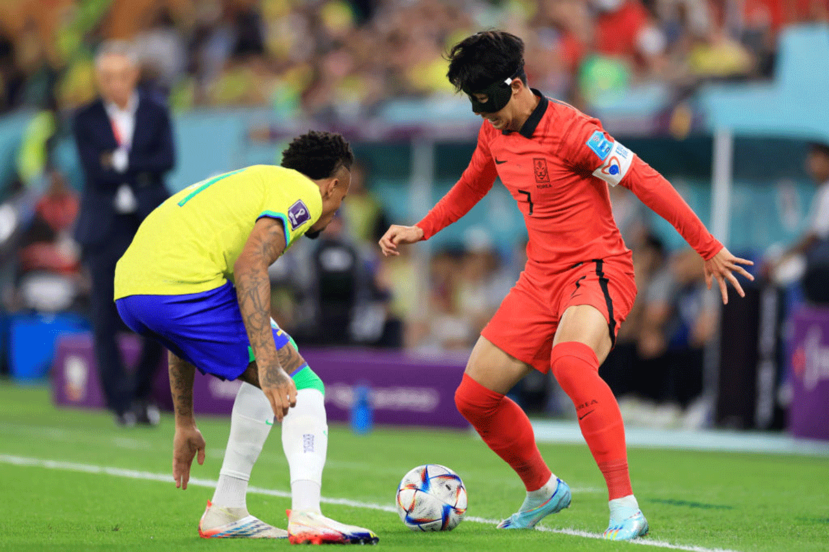 South Korea's Heung-min Son takes on Brazil's Eder Militao