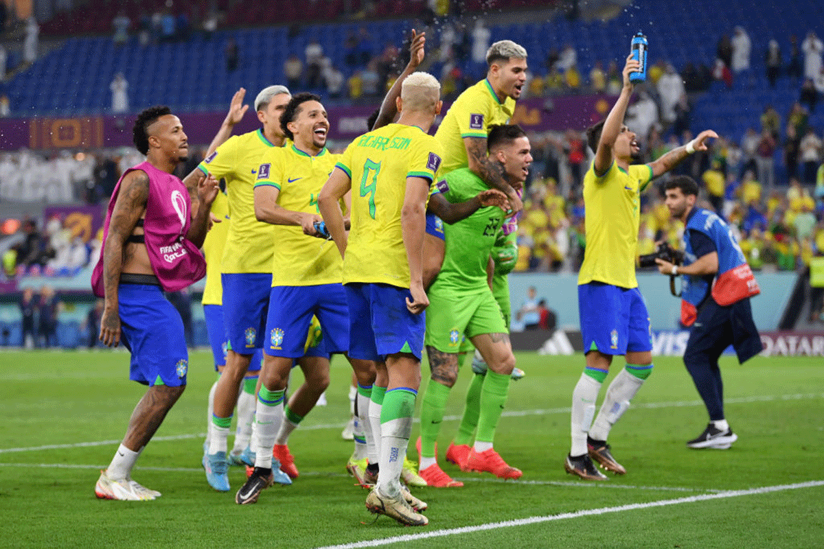 Brazil players celebrate with fans after the team's victory