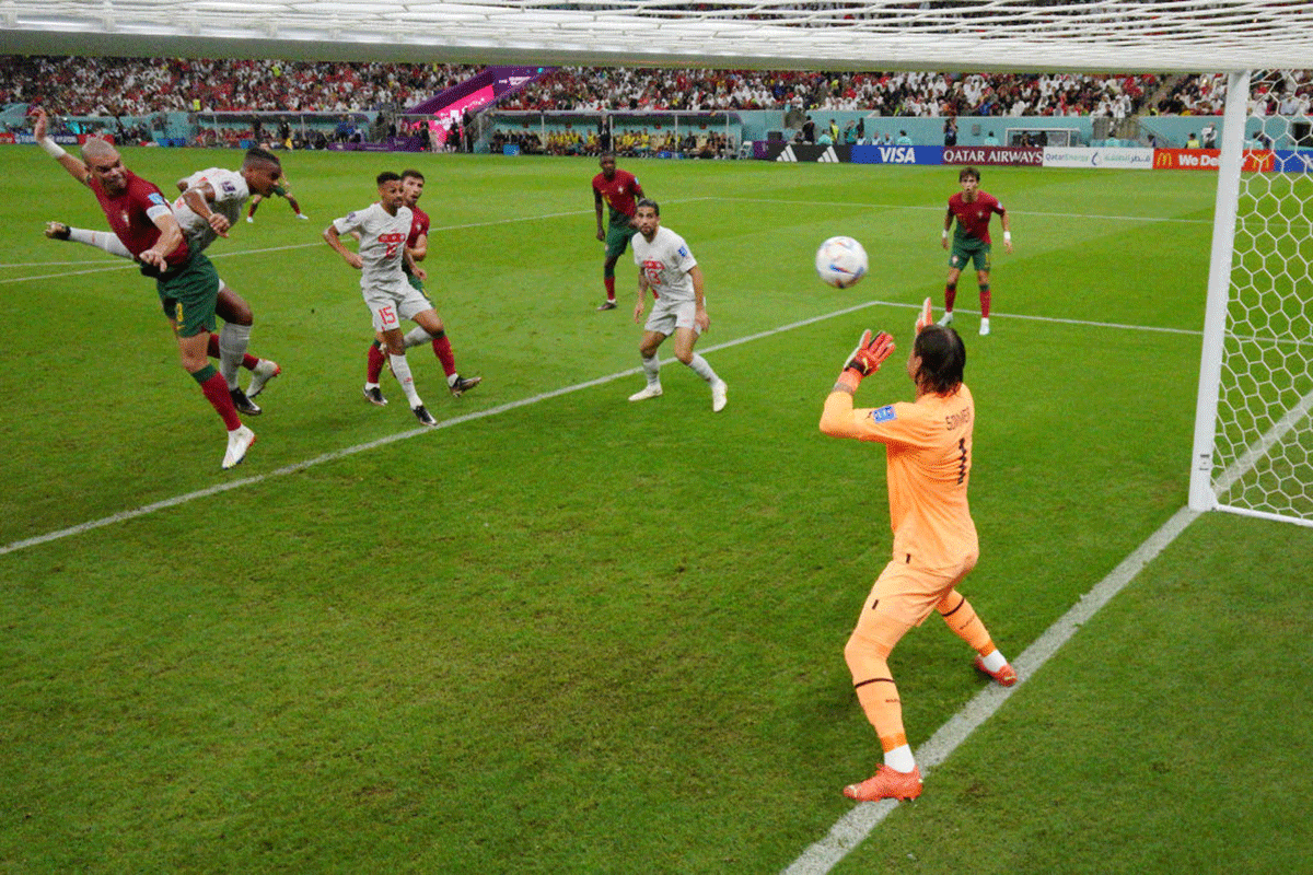 Portugal's Pepe times his jump perfectly and heads to score the second goal off a corner past Switzerland's Yann Sommer