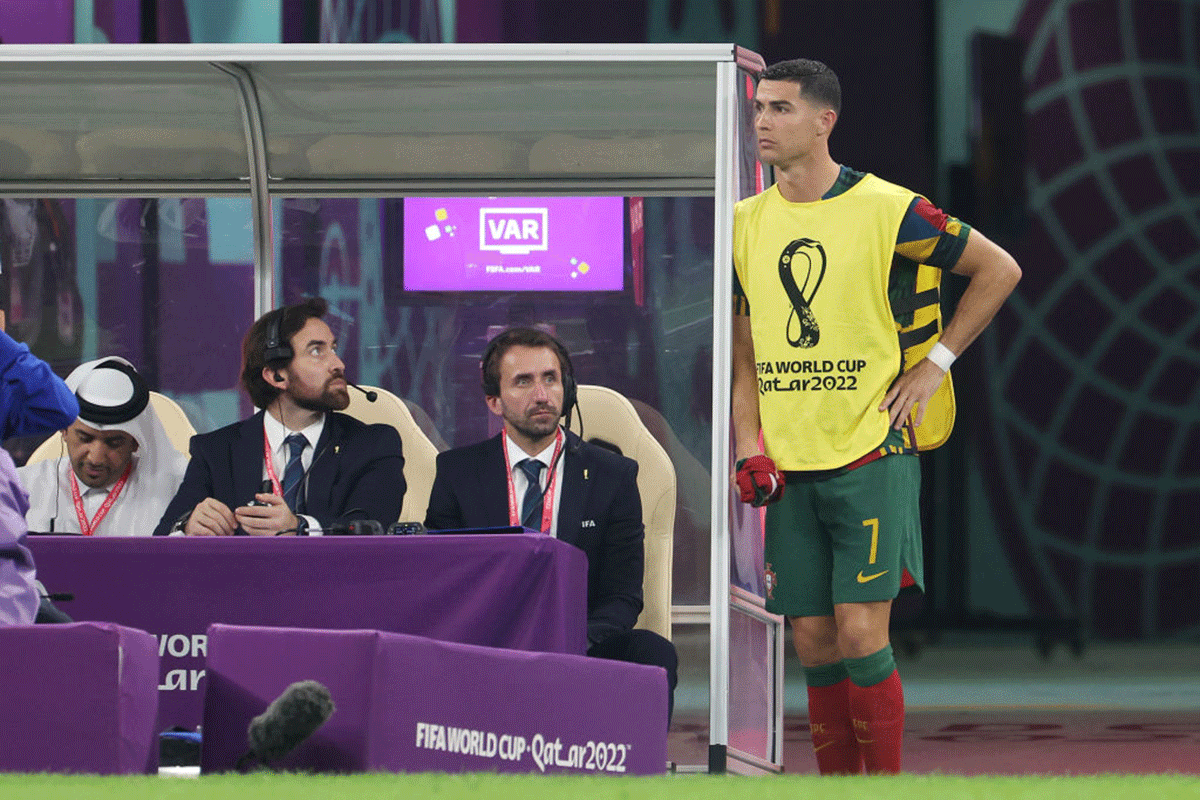 Portugal's Cristiano Ronaldo watches proceedings from the sidelines during the game against Switzerland