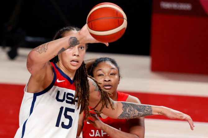 Brittney Griner of the United States in action with Monica Okoye of Japan.