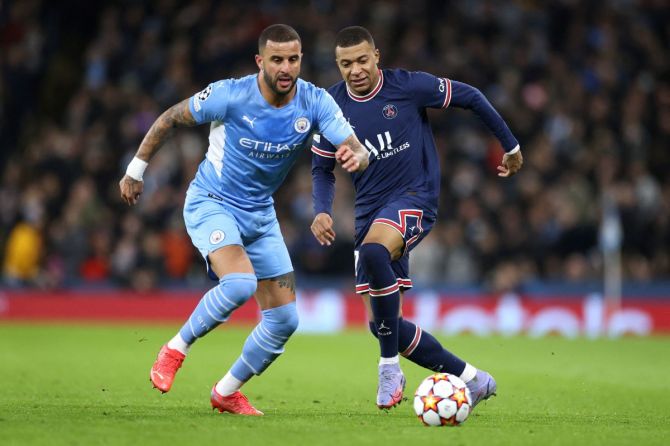  England's Kyle Walker in action against France's Kylian Mbappe in a match of their clubs