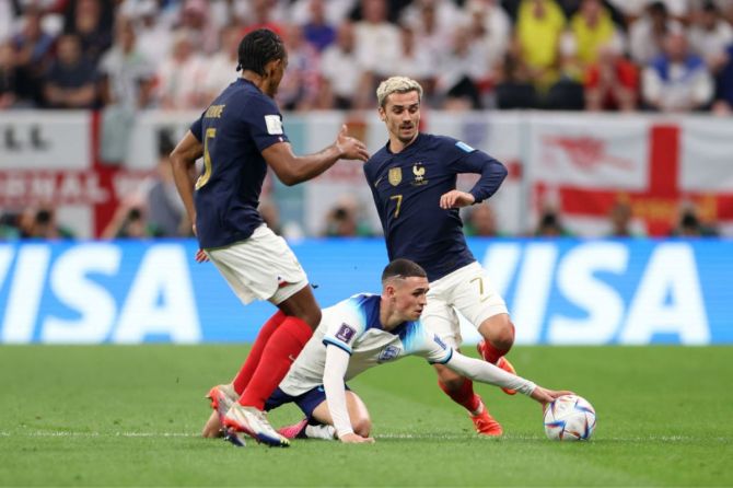 England's Phil Foden battles for possession with France's Antoine Griezmann