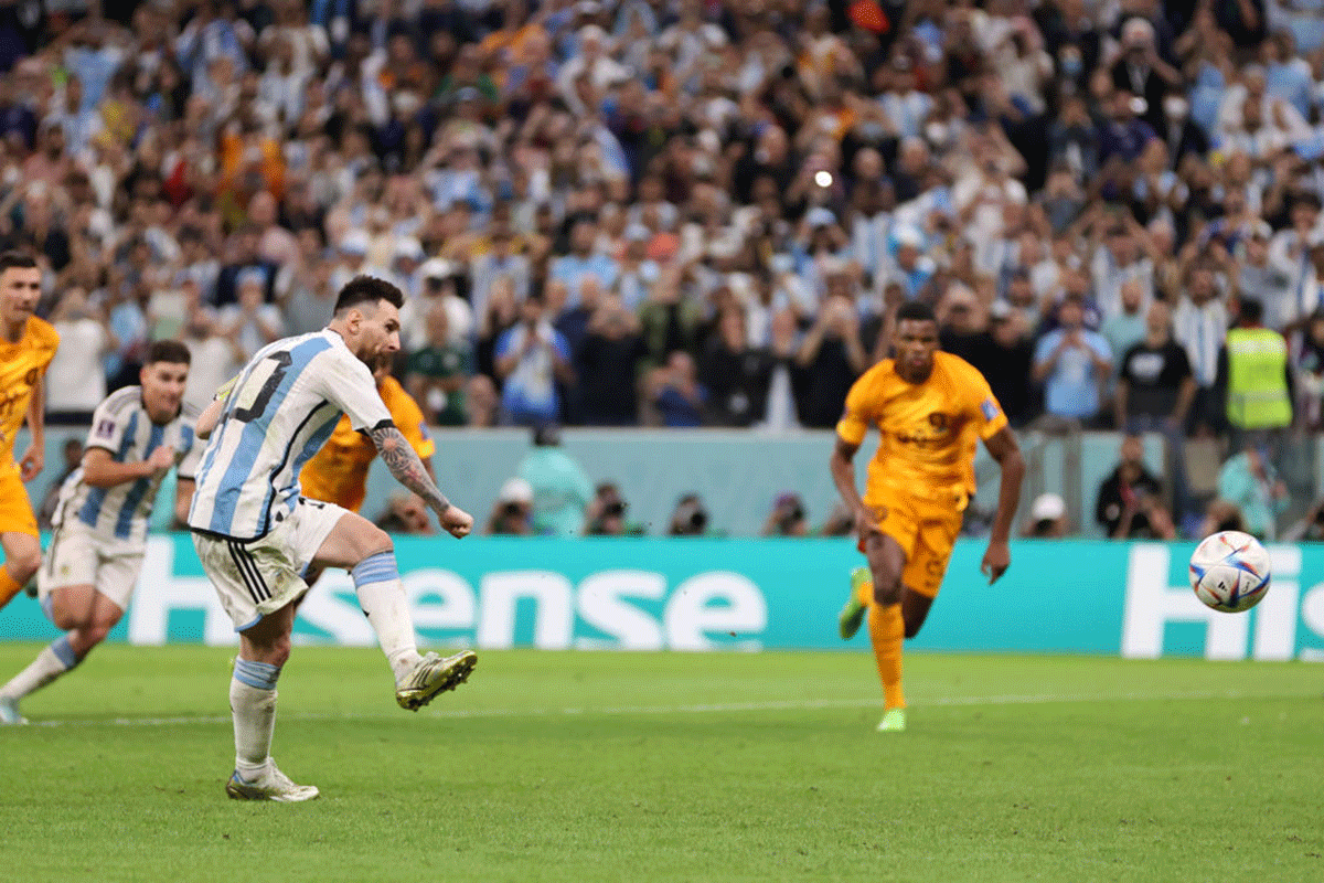 Lionel Messi scores from the penalty spot to score Argentina's second goal