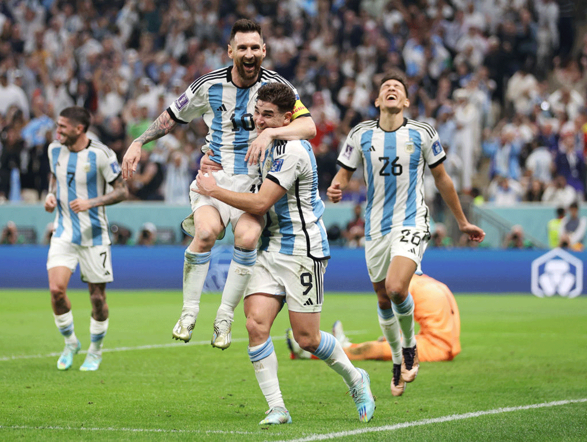 Julian Alvarez celebrates with Lionel Messi