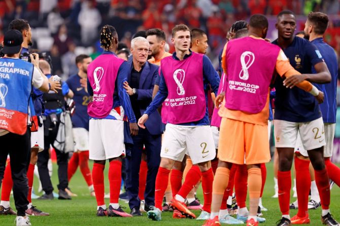 France manager Didier Deschamps with his team after winning a semifinal match against Morocco