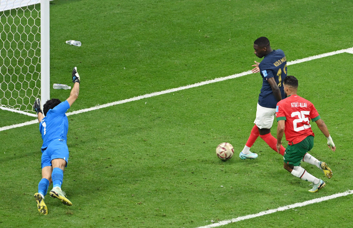 France's Randal Kolo Muani scores the team's second goal past Morocco keeper Yassine Bounou