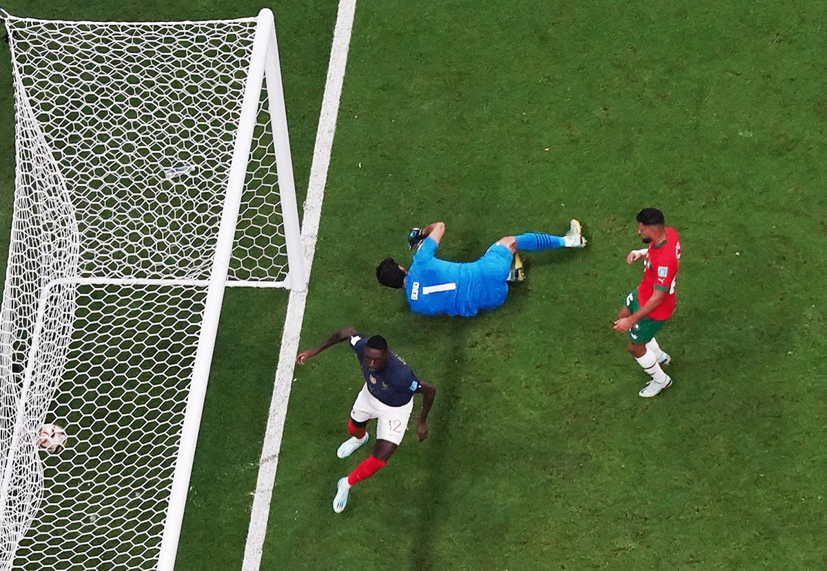 France's Randal Kolo Muani celebrates scoring their second goal as Morocco's Yassine Bounou and Yahya Attiat-Allah react