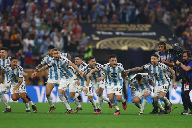 Argentina's Lionel Messi celebrates alongside Nicolas Otamendi, Lautaro Martinez and teammates after winning the World Cup