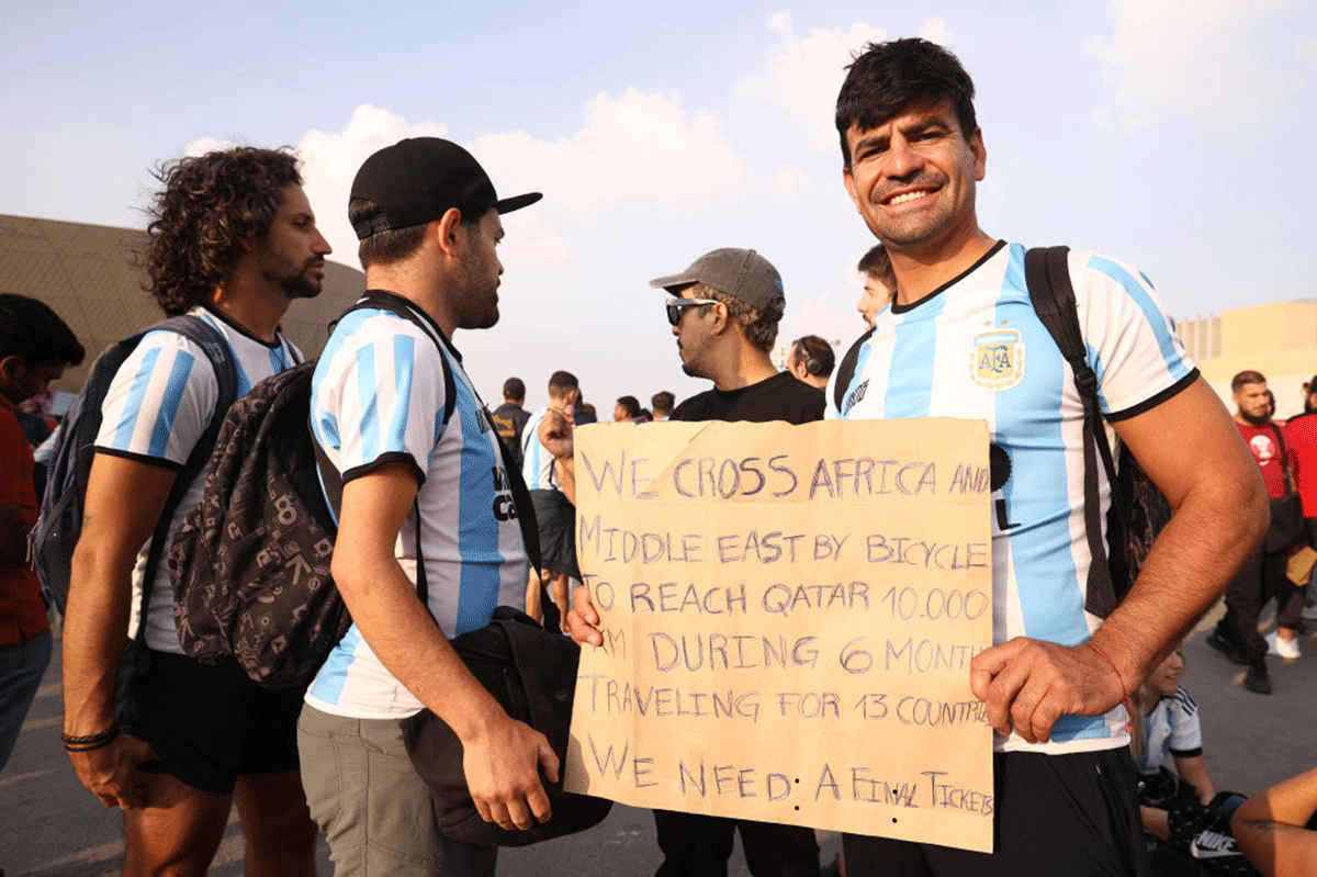  Argentina fans hold a banner detailing their journey to the stadium