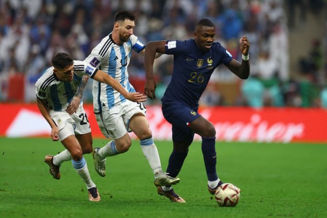 France's Marcus Thuram in action with Argentina's Lionel Messi and Nahuel Molina