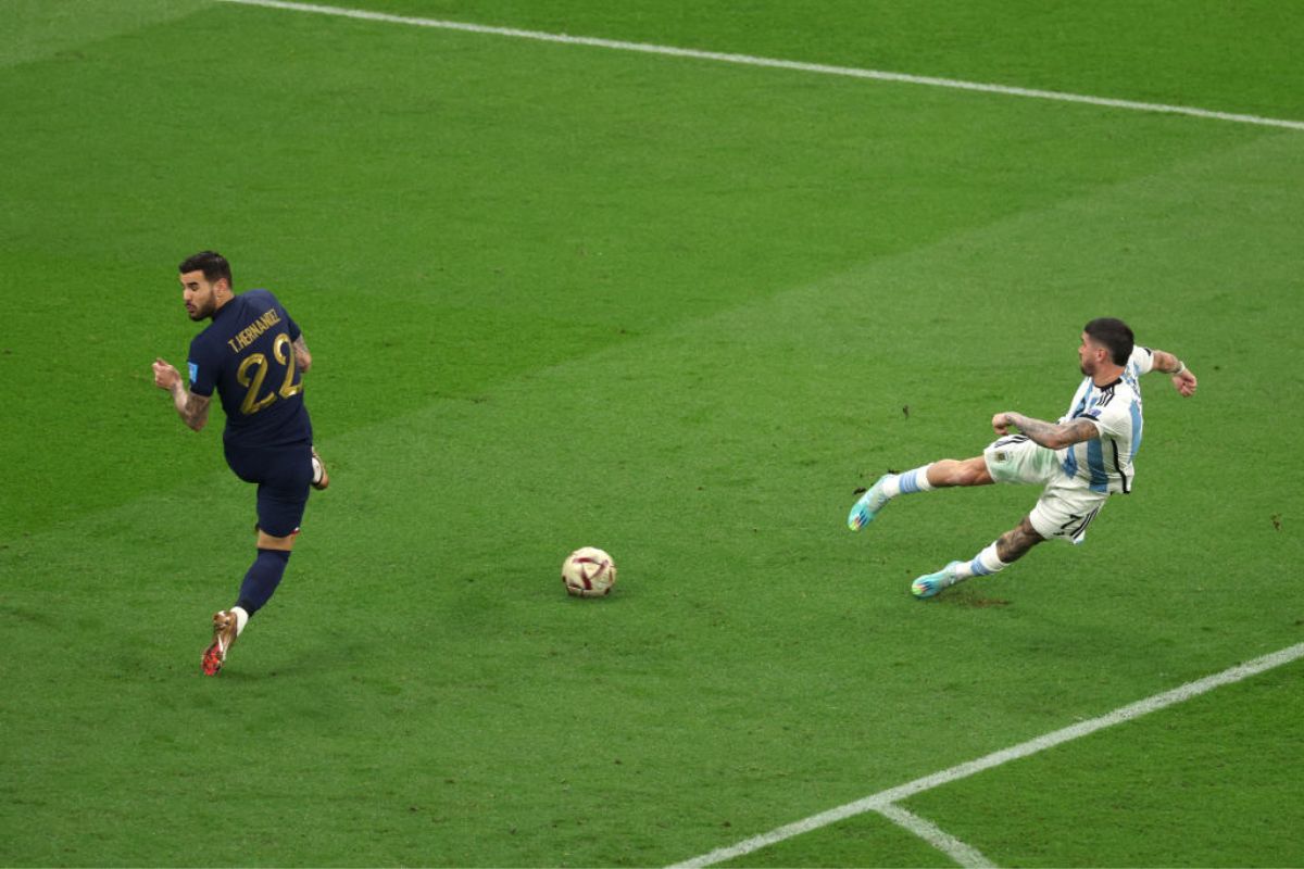 Argentina's Rodrigo De Paul shoots past France's Theo Hernandez