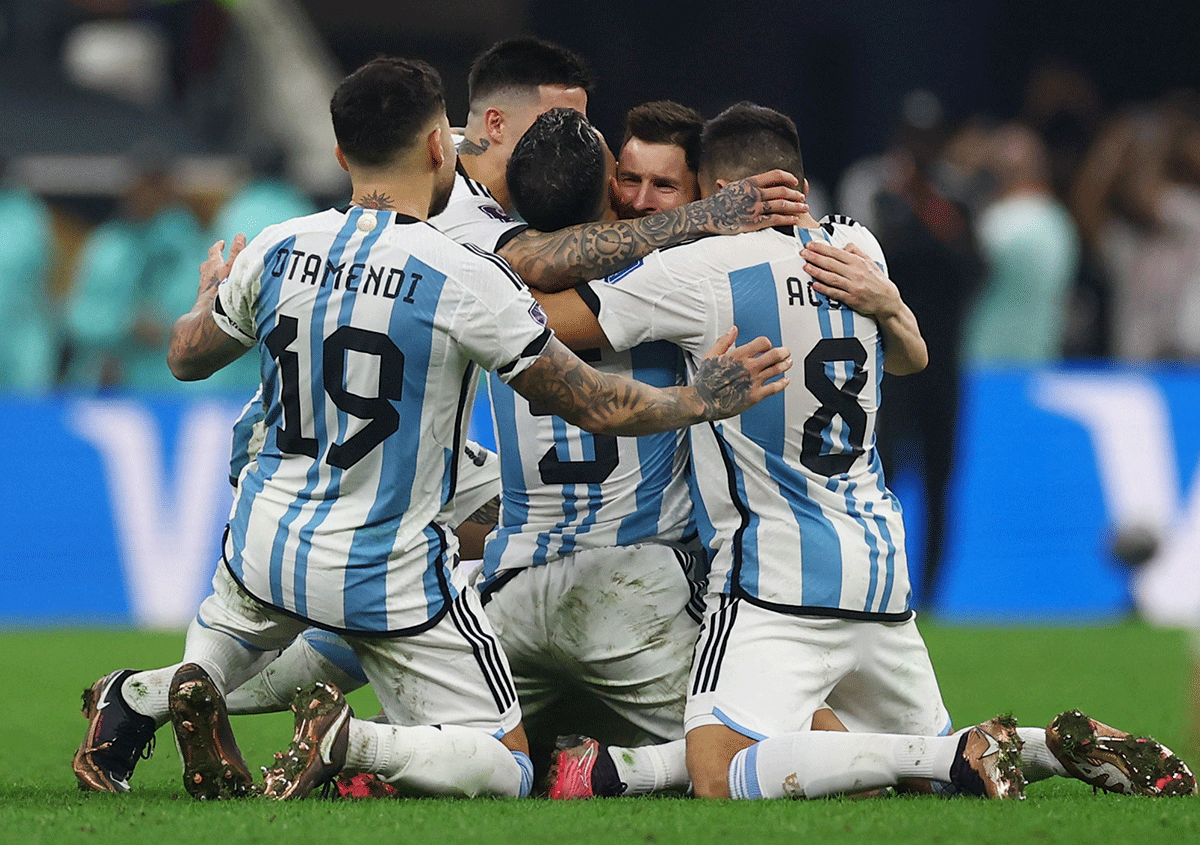 Argentina's Lionel Messi celebrates with teammates after winning the World Cup on Sunday