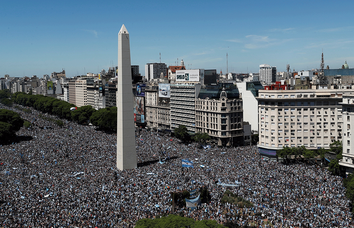 General view of the Obelisco as Argentina fans are seen ahead of the victory parade 
