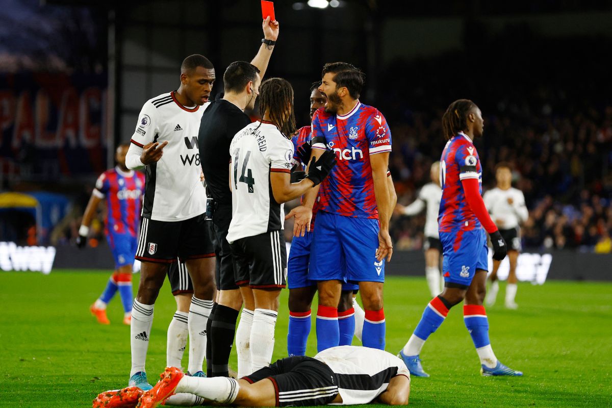  Crystal Palace's James Tomkins is shown a red card by referee Andrew Madley