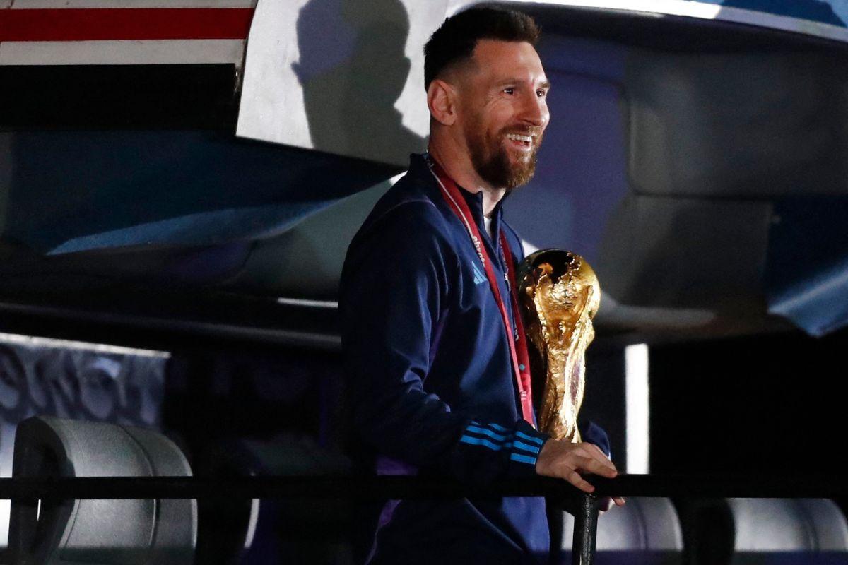 Argentina's Lionel Messi with the trophy during the team's arrival