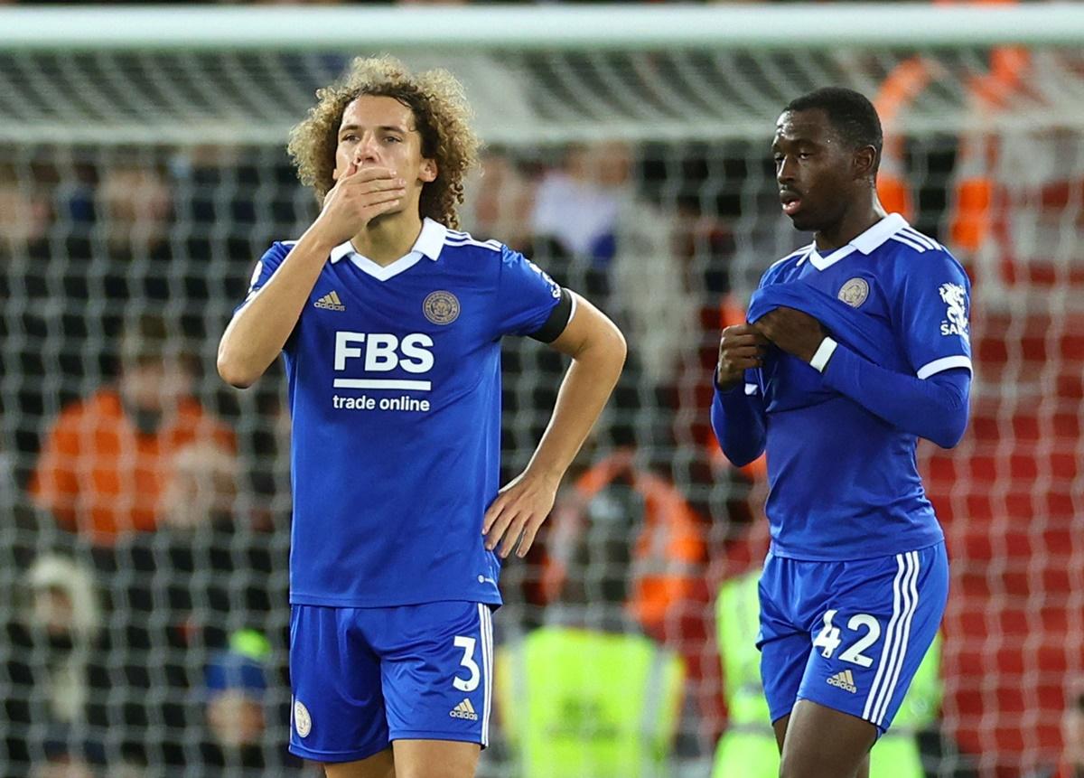 Leicester City's Wout Faes reacts after scoring an own goal, Liverpool's second, as Boubakary Soumare looks on during the Premier League match at Anfield, Liverpool, on Friday.