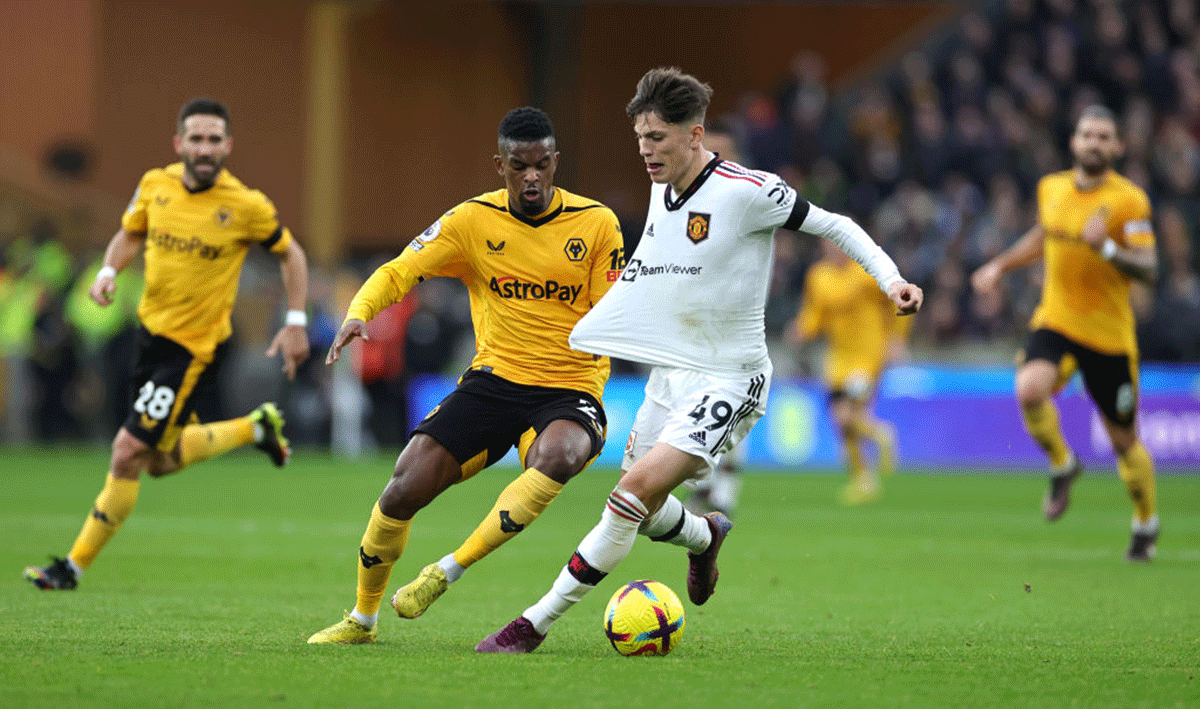 Manchester United's Alejandro Garnacho is challenged by Wolverhampton Wanderers' Nelson Semedo 