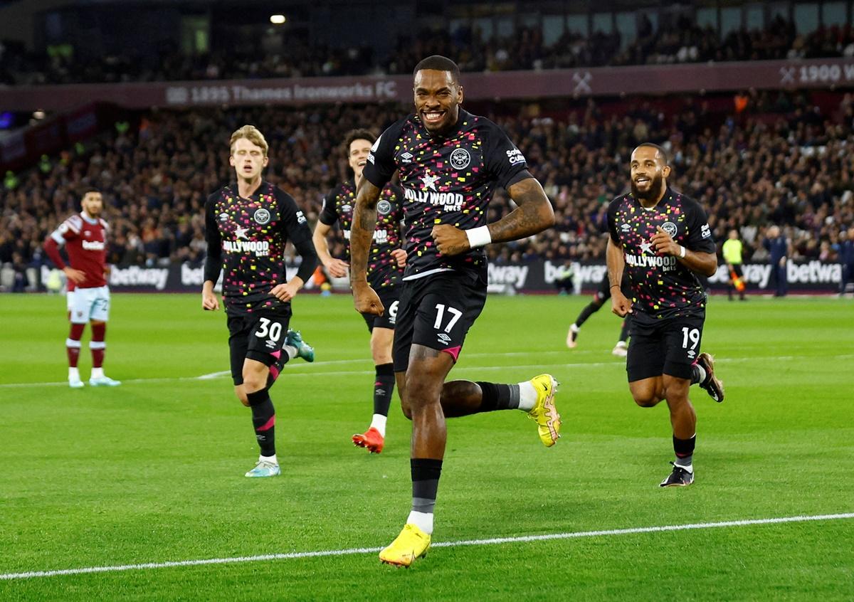 Ivan Toney celebrates scoring Brentford's first goal against West Ham United, at London Stadium. 