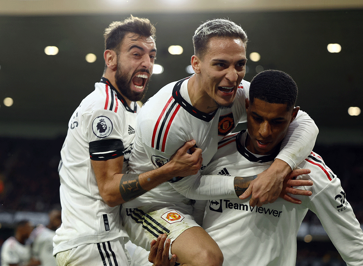 Manchester United's Marcus Rashford celebrates scoring a goal that was later disallowed with Antony and Bruno Fernandes