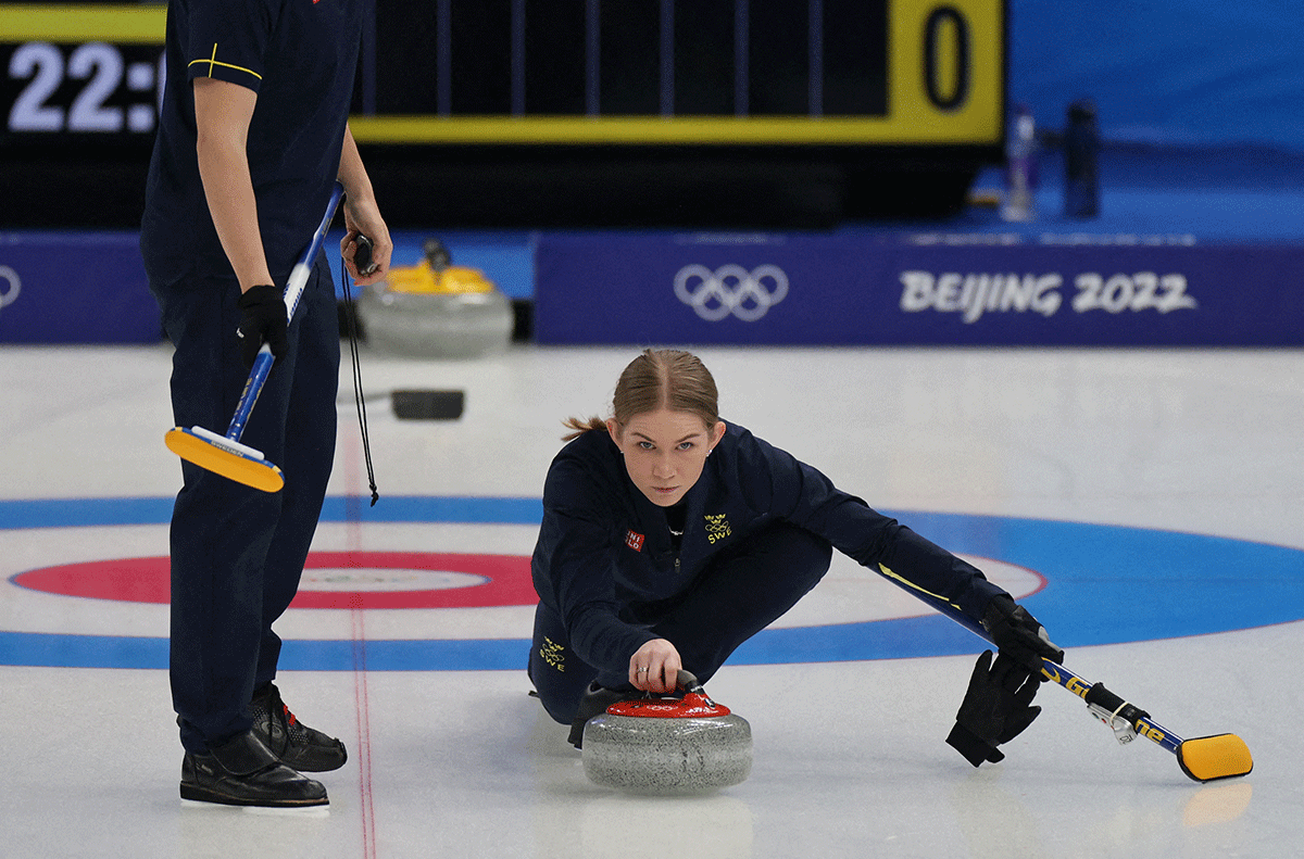 Sweden's Almida De Val and Oskar Eriksson in action against Britain in the Curling - Mixed Doubles Round Robin Session 1 at the National Aquatics Center, Beijing, China on Wednesday