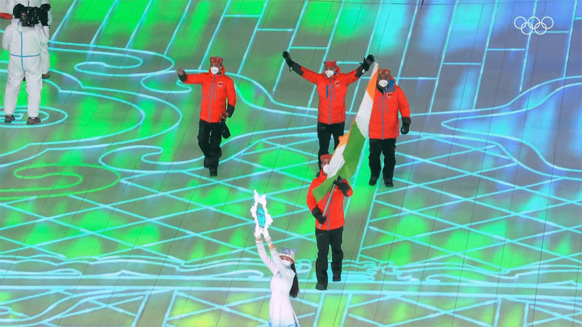 India's Arif Khan leads the Indian contingent out at the opening of the Beijing Winter Games on Friday