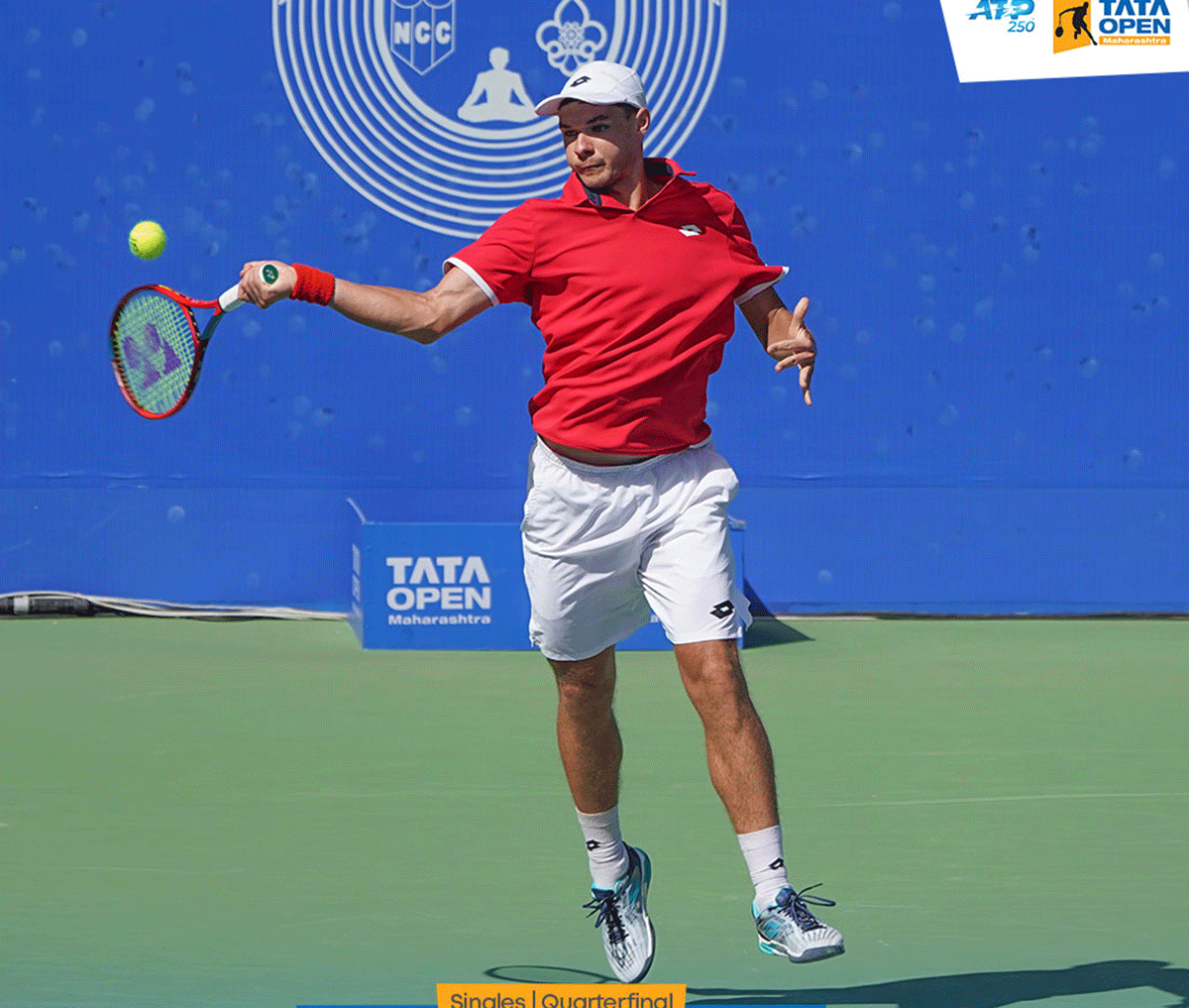 Poland's Kamil Majchrzak plays a return during his victory over second seed Lorenzo Musetti in the quarter-final of the Tata Open Maharashtra at the Balewadi Stadium in Pune on Friday