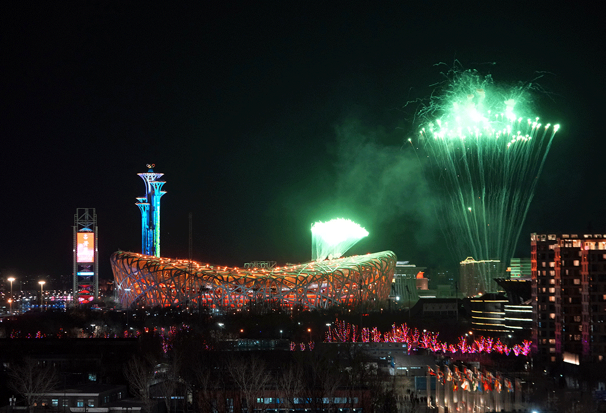 Fireworks explode over the National Stadium, also known as the Bird's Nest, during the Beijing 2022 Winter Olympics opening ceremony, in Beijing, China, on Friday