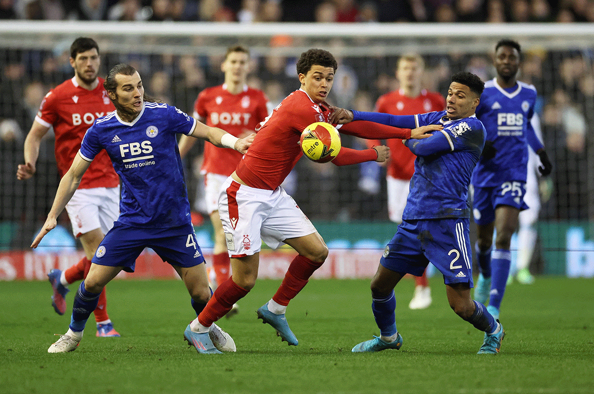 Nottingham Forest's Brennan Johnson and Leicester City's Caglar Soyuncu and James Justin vie for possession
